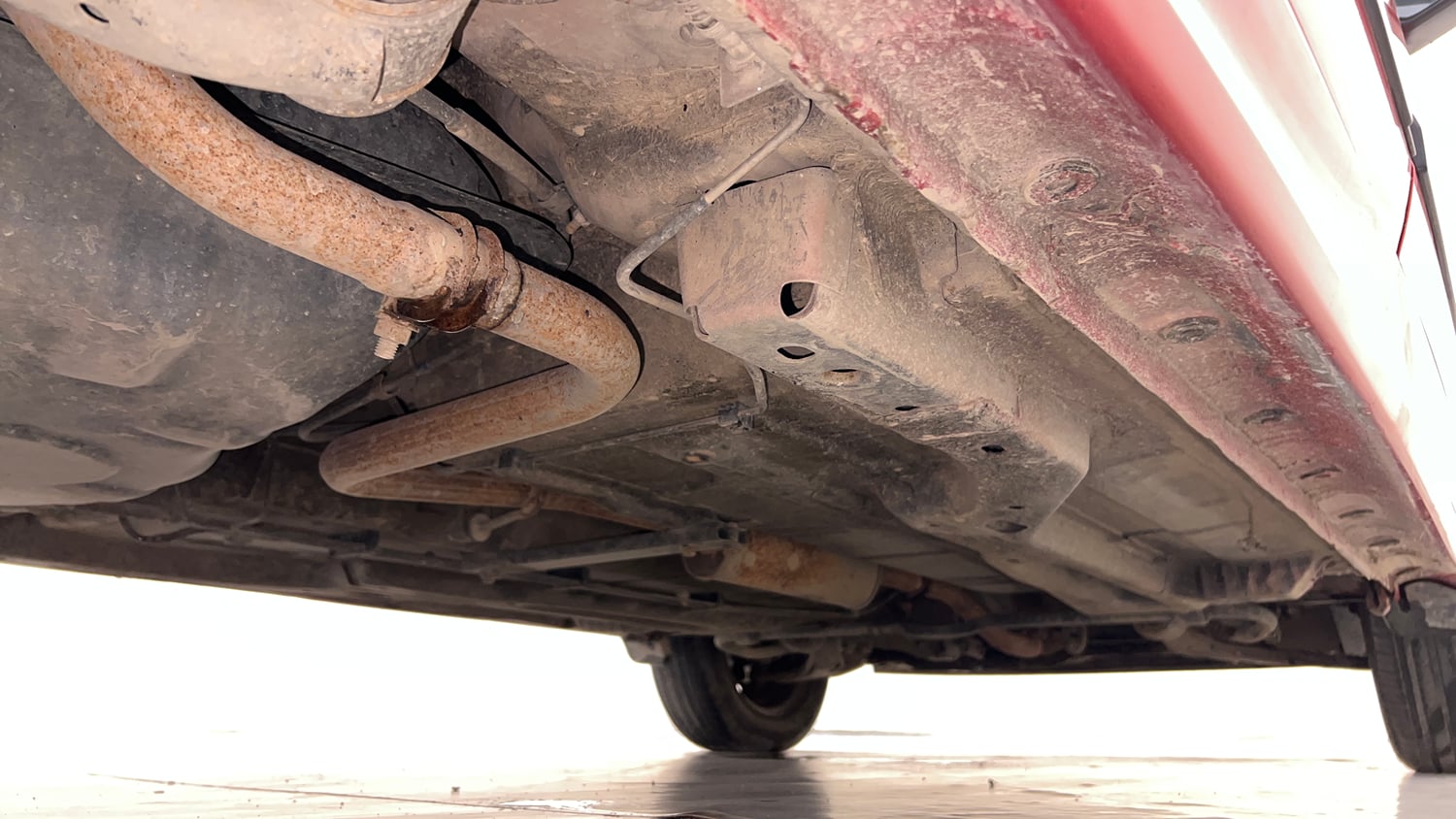 Used 2016 Tata Tiago Revotron XZ w/o Alloy Petrol Manual extra REAR RIGHT UNDERBODY VIEW