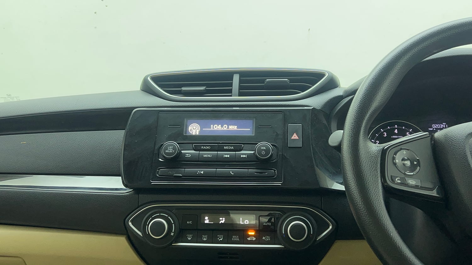 Used 2019 Honda Amaze 1.2 V MT Petrol Petrol Manual top_features Integrated (in-dash) music system
