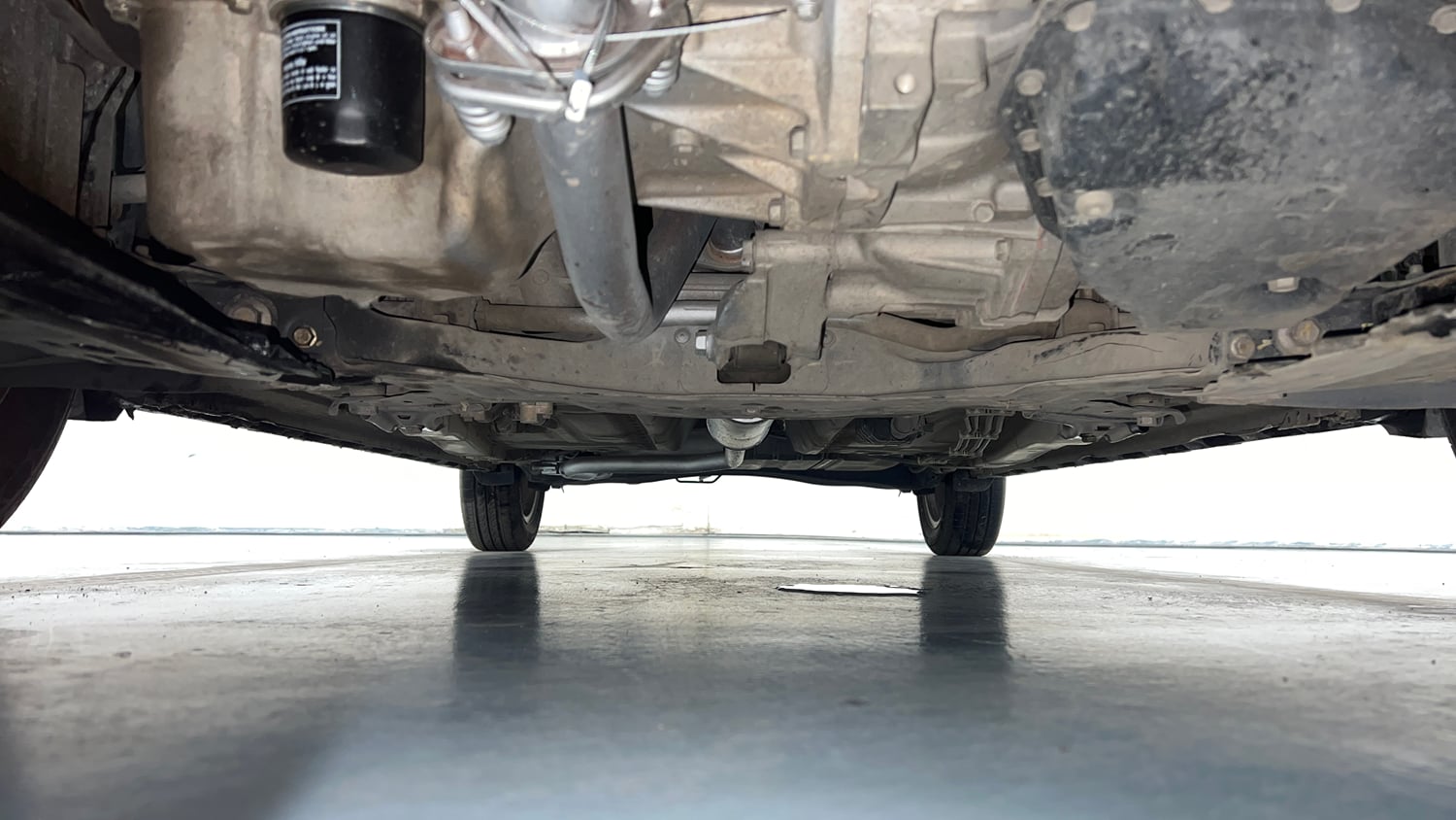 Used 2021 Maruti Suzuki XL6 Zeta AT Petrol Petrol Automatic extra FRONT LEFT UNDERBODY VIEW