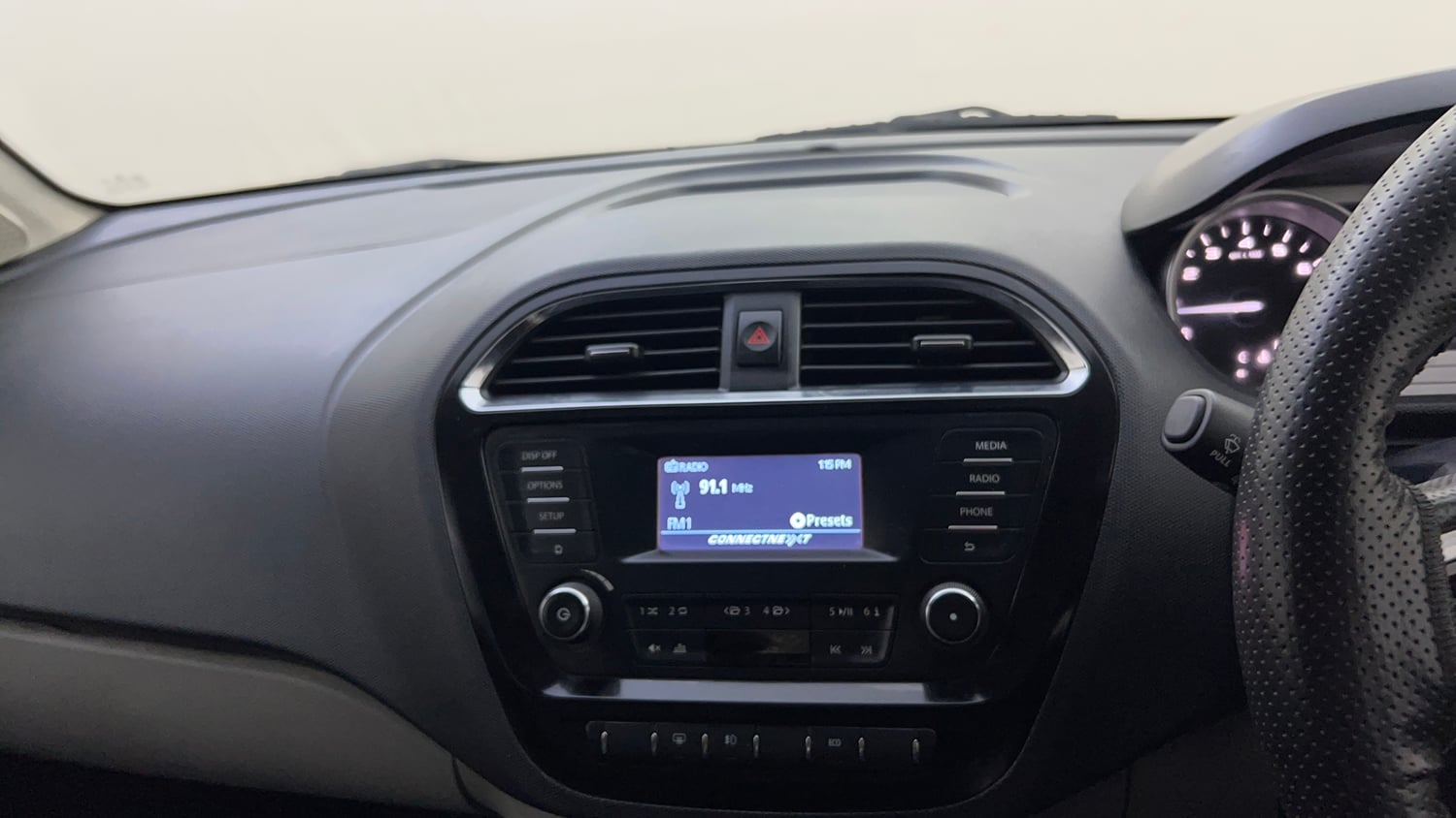 Used 2016 Tata Tiago Revotron XZ w/o Alloy Petrol Manual top_features Integrated (in-dash) music system