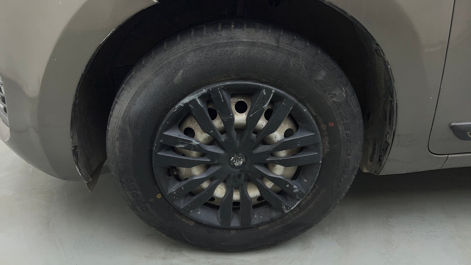 Used 2021 Maruti Suzuki Swift LXi Petrol Manual tyres LEFT FRONT TYRE RIM VIEW