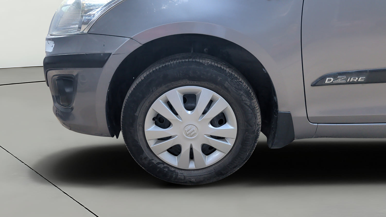Used 2014 Maruti Suzuki Swift Dzire VXI Petrol Manual tyres LEFT FRONT TYRE RIM VIEW