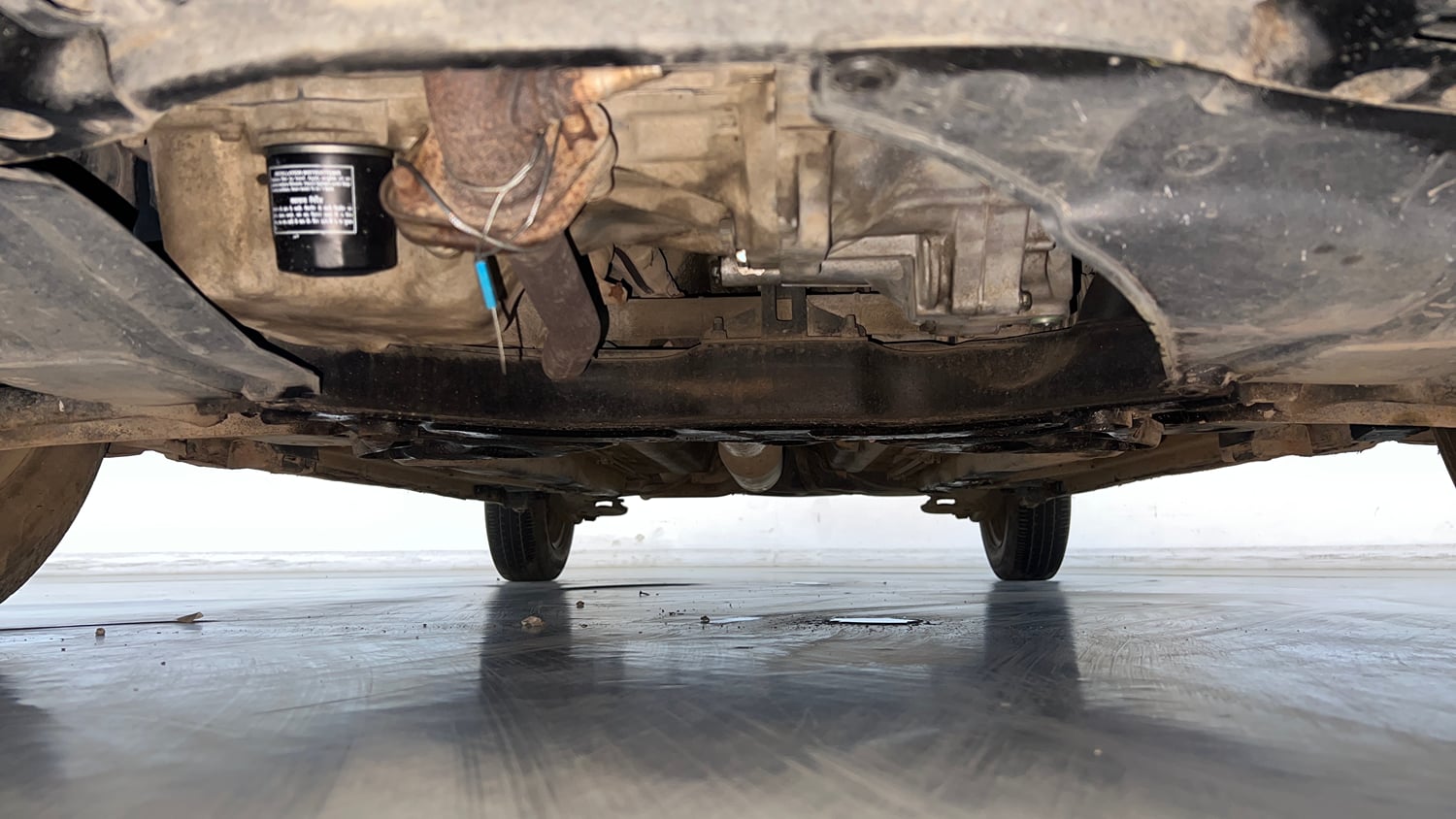 Used 2017 Maruti Suzuki Swift Lxi (O) Petrol Manual extra FRONT LEFT UNDERBODY VIEW