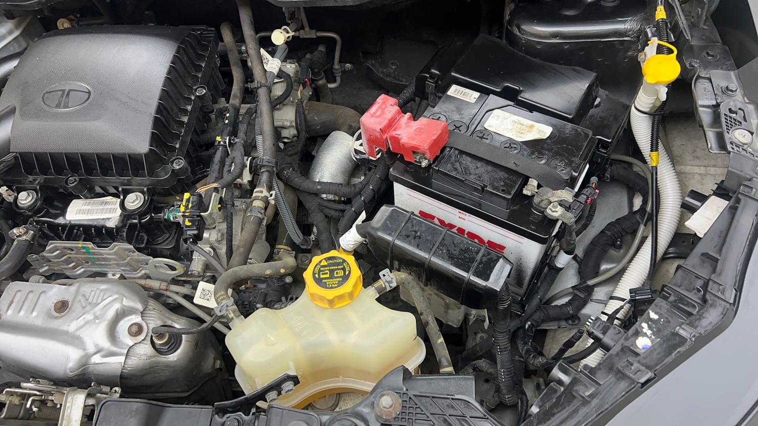Used 2024 Tata Nexon Creative Plus S 1.2 Revotron Petrol 6AMT Petrol Automatic engine ENGINE LEFT SIDE VIEW