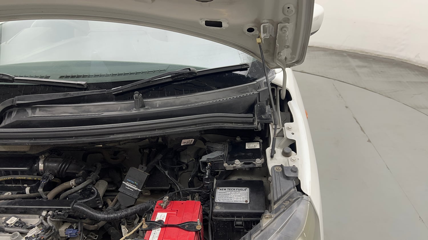 Used 2022 Maruti Suzuki Wagon R 1.0 VXi (O) 1.0 Petrol Manual engine ENGINE LEFT SIDE HINGE & APRON VIEW