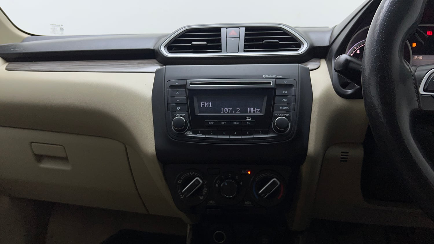 Used 2020 Maruti Suzuki Dzire VXi Petrol Manual top_features Integrated (in-dash) music system