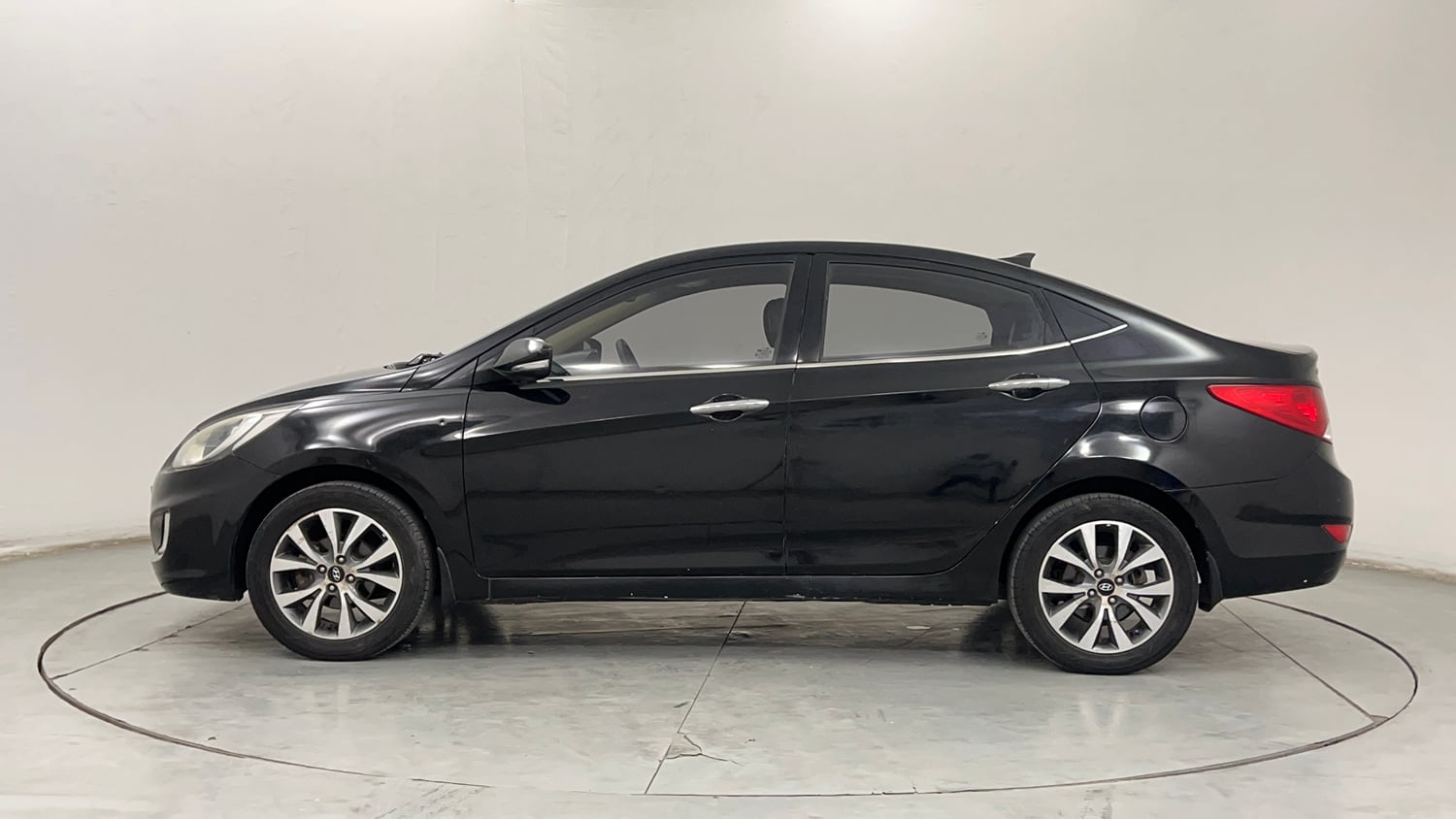 Used 2013 Hyundai Verna Fluidic 1.6 VTVT SX Petrol Manual exterior LEFT SIDE VIEW