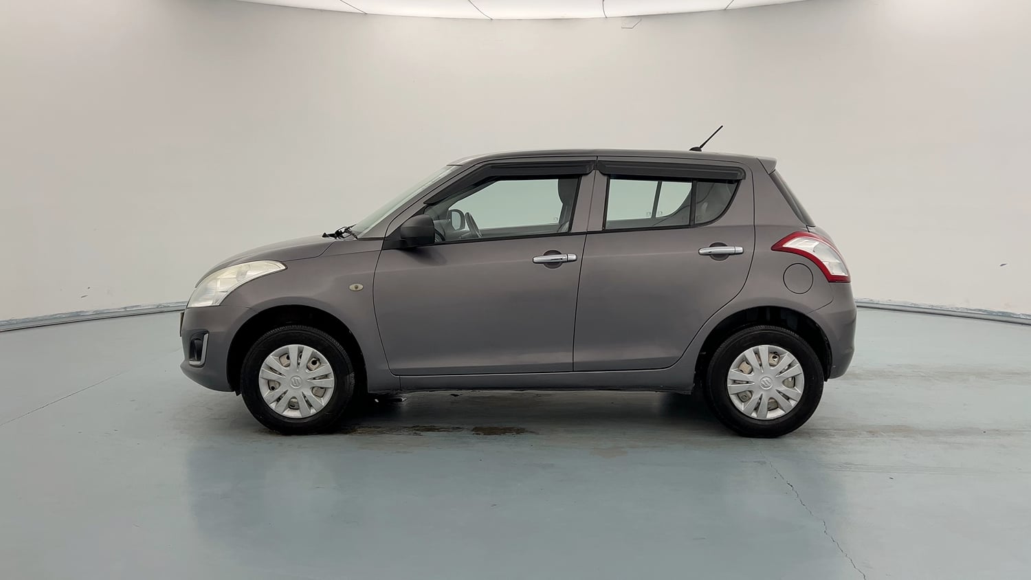 Used 2017 Maruti Suzuki Swift LXi Petrol Manual exterior LEFT SIDE VIEW