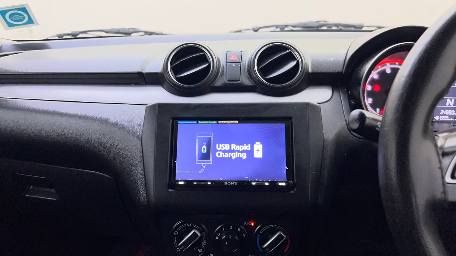 Used 2021 Maruti Suzuki Swift VXi AMT Petrol Automatic top_features Integrated (in-dash) music system