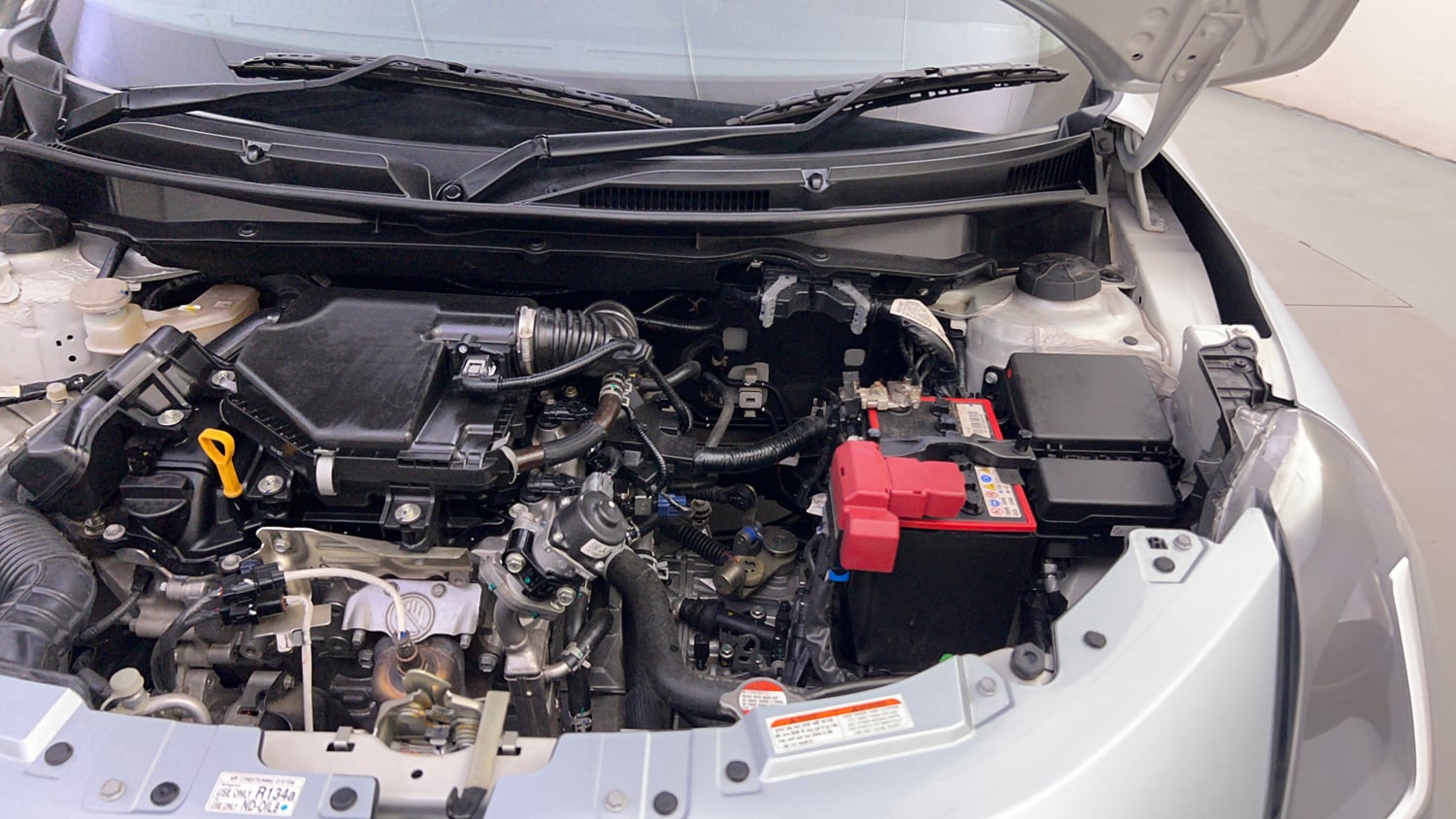 Used 2026 Maruti Suzuki Swift VXi (O) Petrol Manual engine ENGINE LEFT SIDE HINGE & APRON VIEW