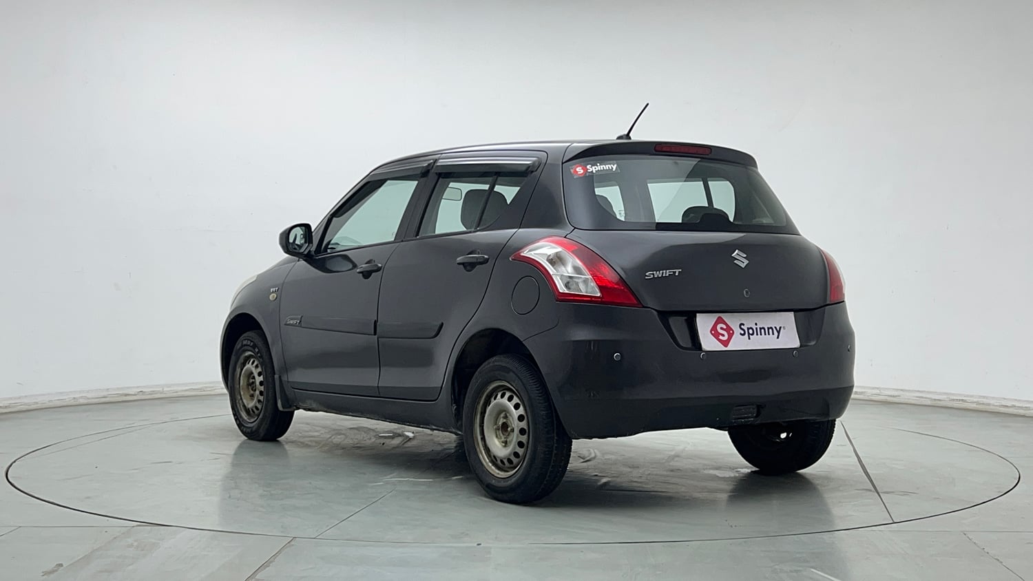 Used 2017 Maruti Suzuki Swift Lxi (O) Petrol Manual exterior LEFT REAR CORNER VIEW