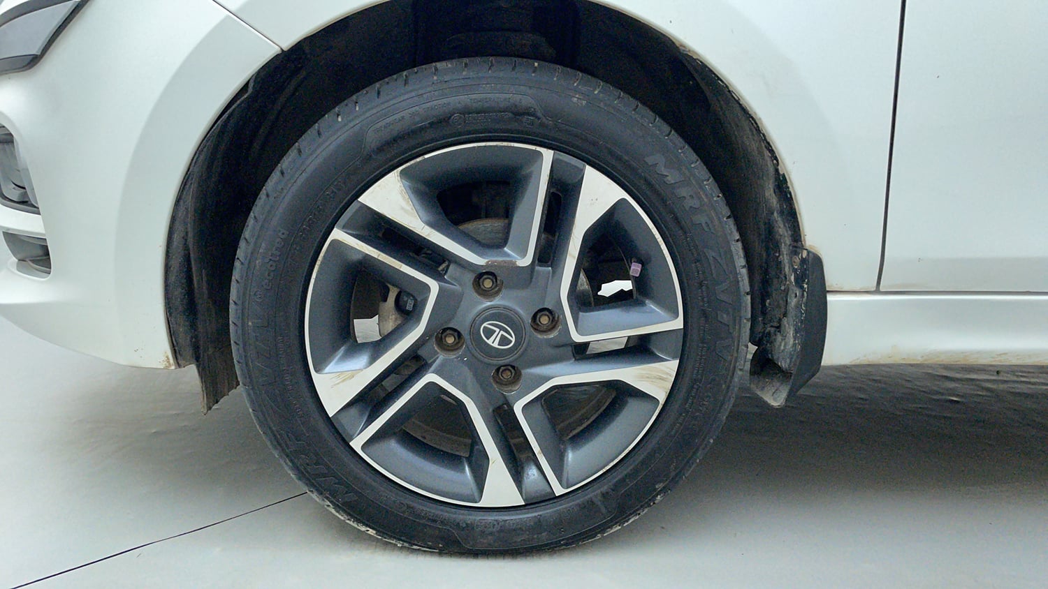 Used 2021 Tata Tiago XZ Plus Dual Tone Petrol Manual tyres LEFT FRONT TYRE RIM VIEW