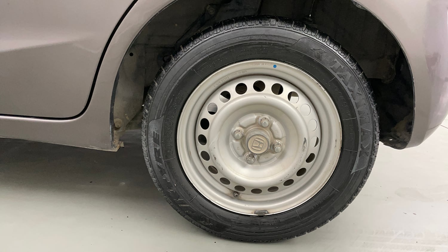 Used 2013 Honda Brio E MT Petrol Manual tyres LEFT REAR TYRE RIM VIEW