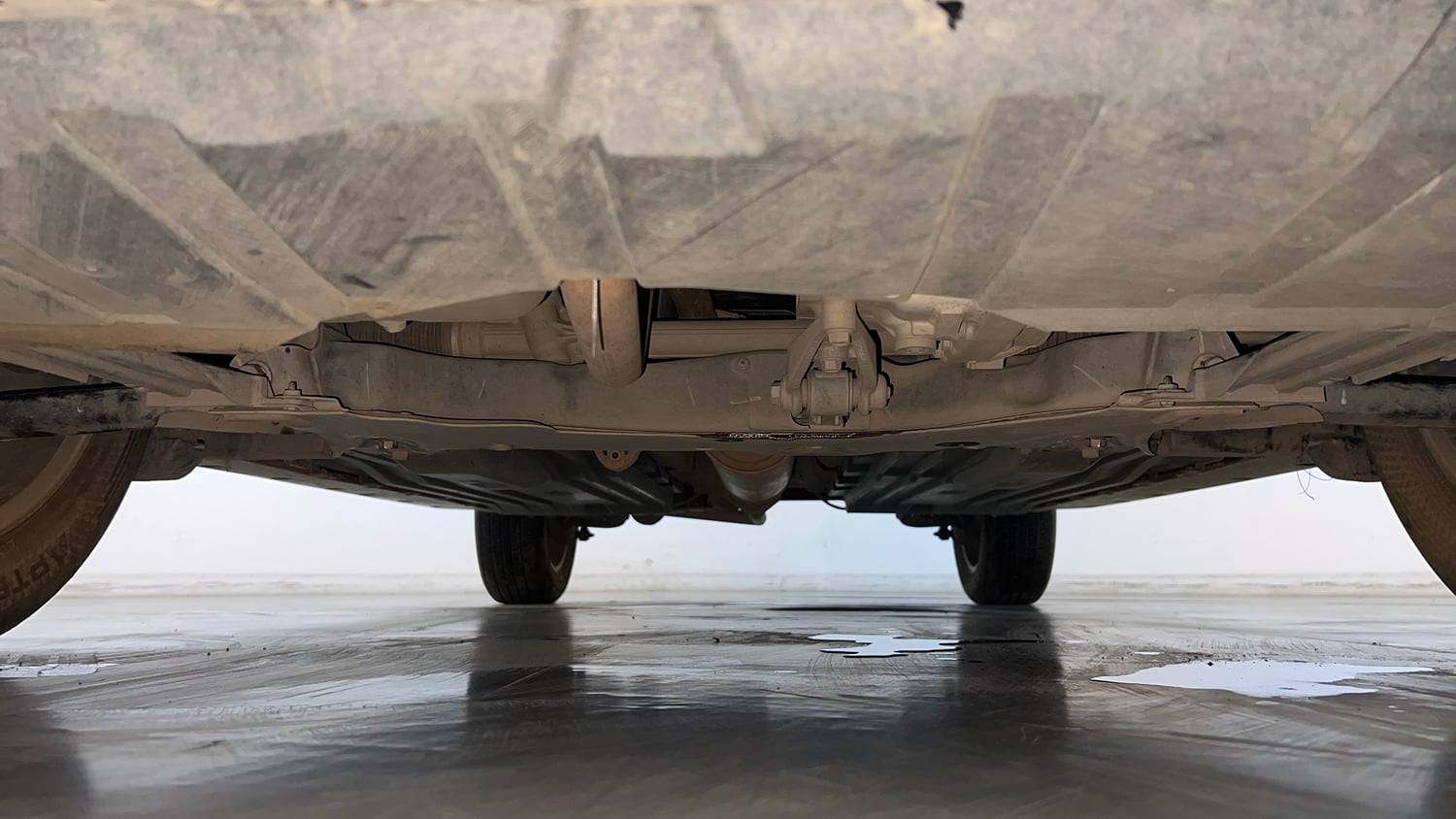 Used 2023 Maruti Suzuki Grand Vitara Alpha Smart Hybrid AT Petrol Automatic extra FRONT LEFT UNDERBODY VIEW