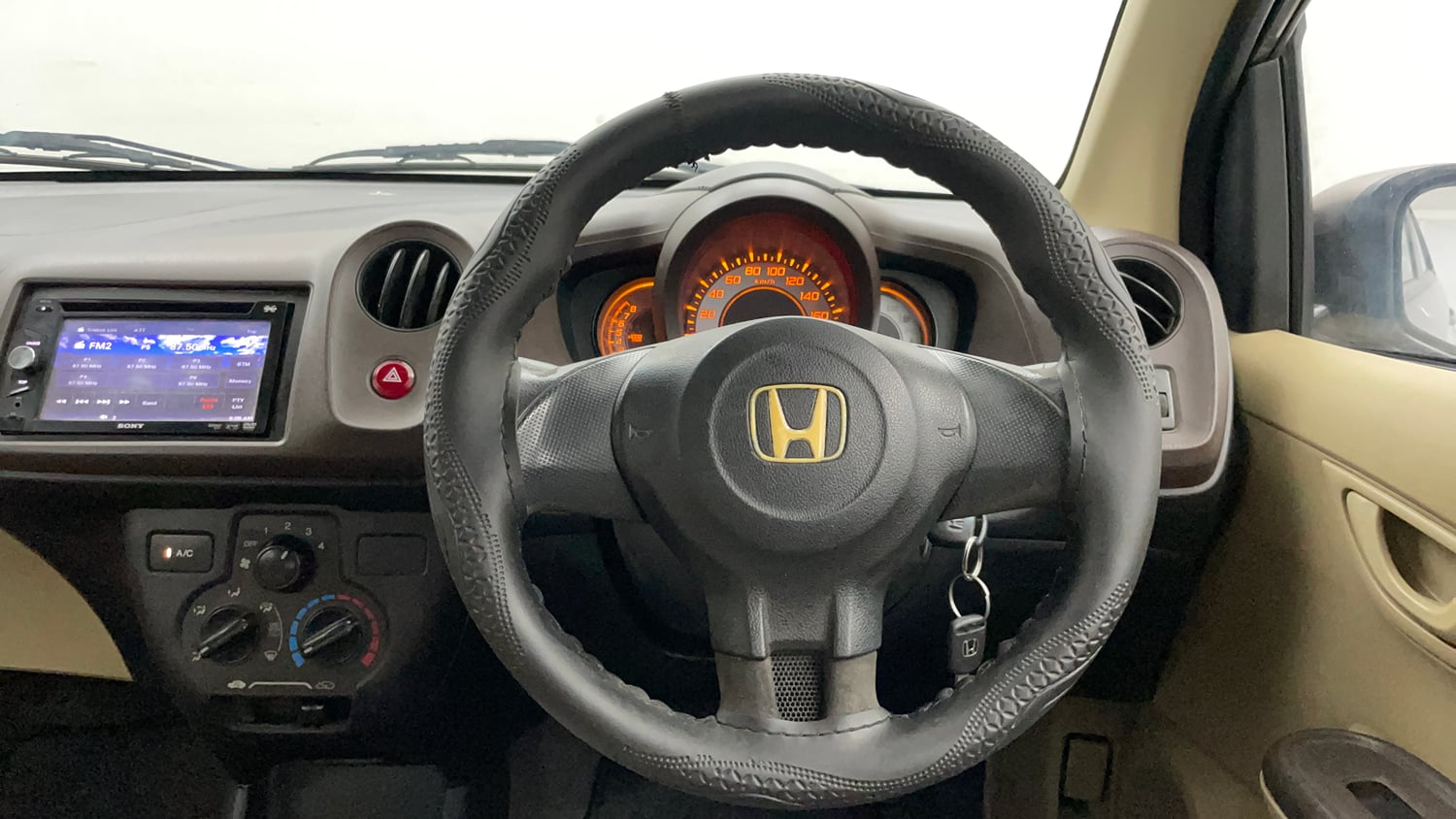 Used 2013 Honda Brio E MT Petrol Manual interior STEERING VIEW