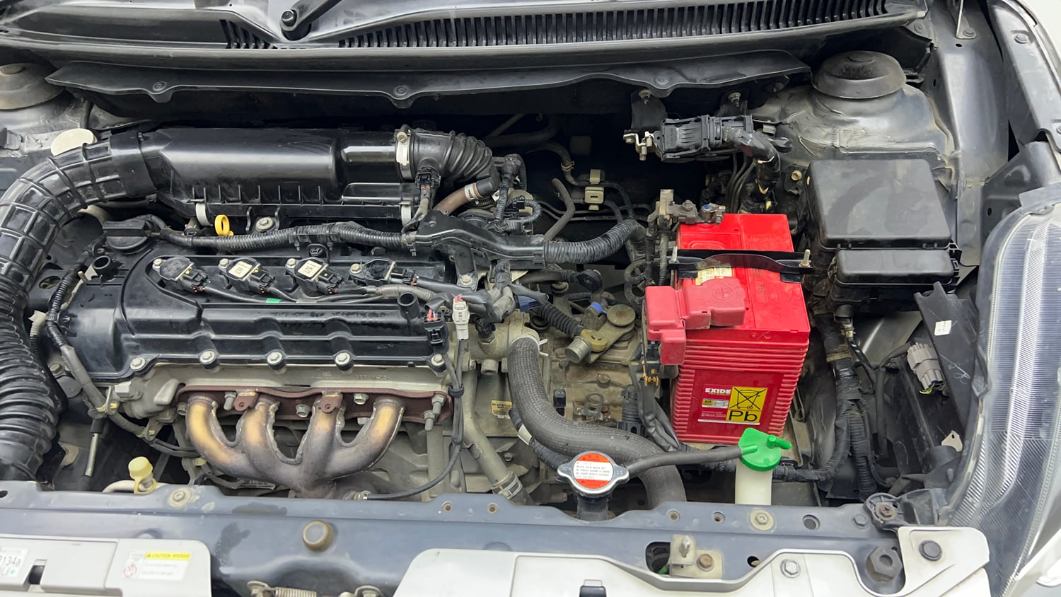 Used 2019 Maruti Suzuki Baleno Delta Petrol Manual engine ENGINE LEFT SIDE VIEW
