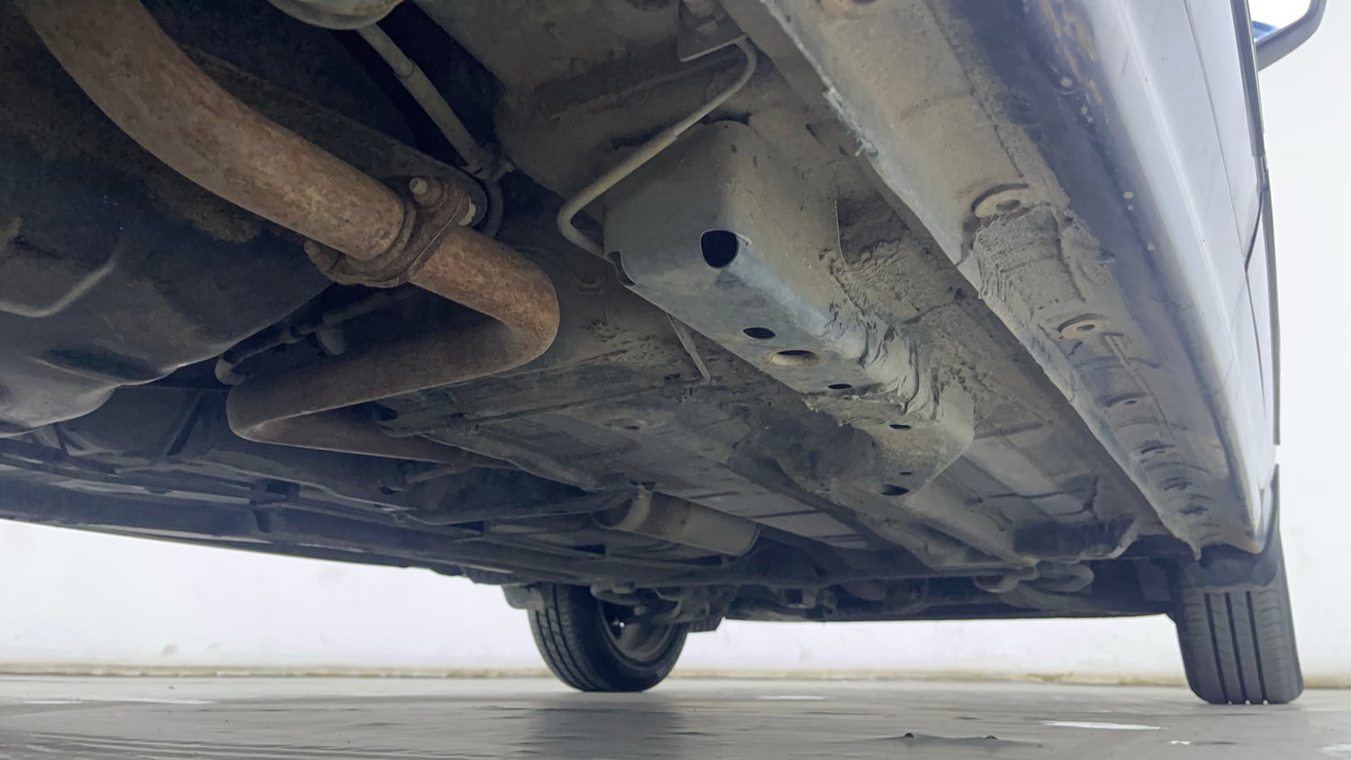 Used 2023 Tata Tigor XZ Plus Petrol Manual extra REAR RIGHT UNDERBODY VIEW