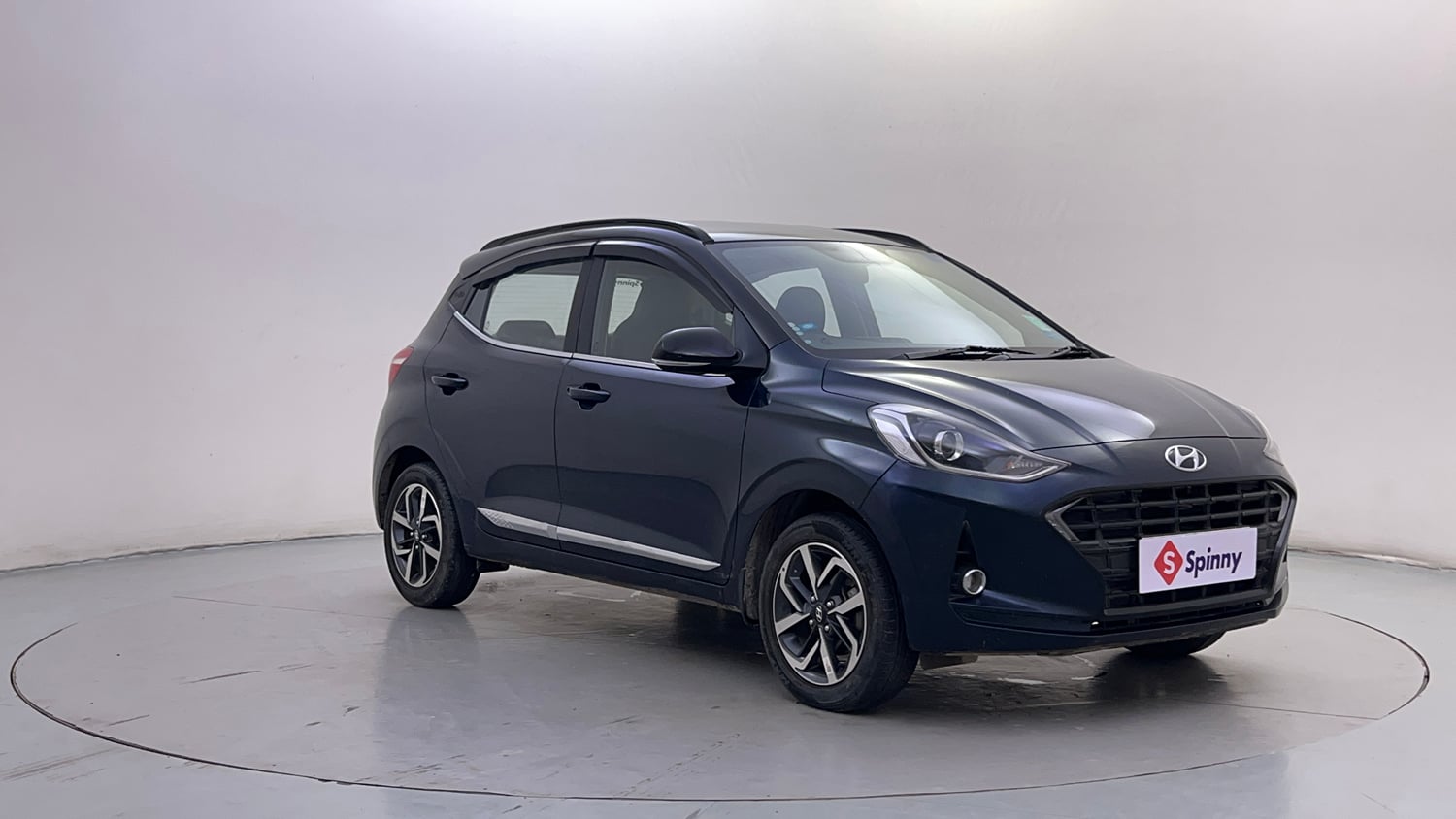 Used 2021 Hyundai Grand i10 Nios Sportz 1.2 Kappa VTVT Dual Tone Petrol Manual exterior RIGHT FRONT CORNER VIEW