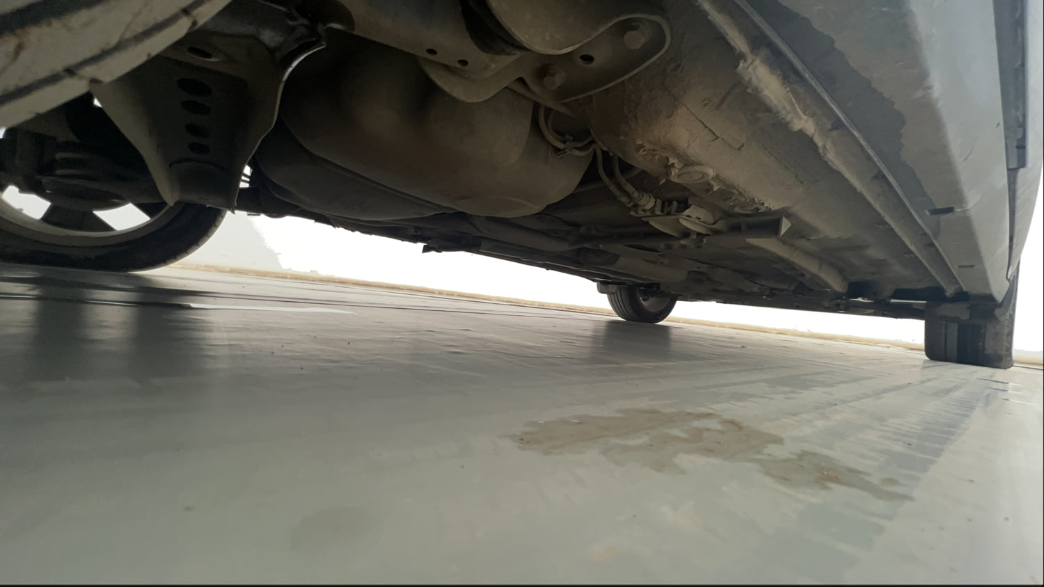 Used 2023 Volkswagen Taigun Topline 1.0 TSI MT Petrol Manual extra REAR RIGHT UNDERBODY VIEW