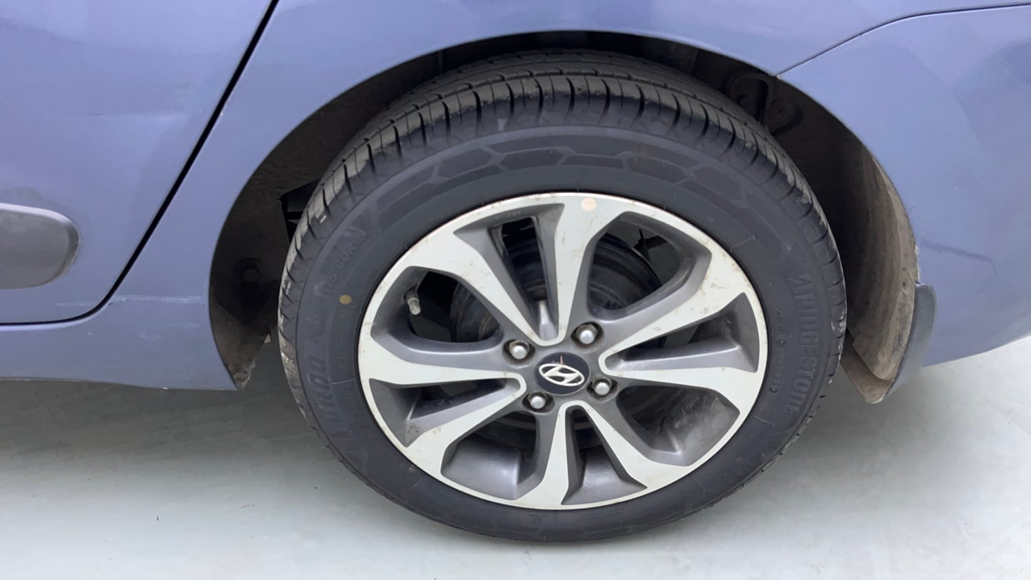 Used 2014 Hyundai Xcent SX 1.2 (O) Petrol Manual tyres LEFT REAR TYRE RIM VIEW
