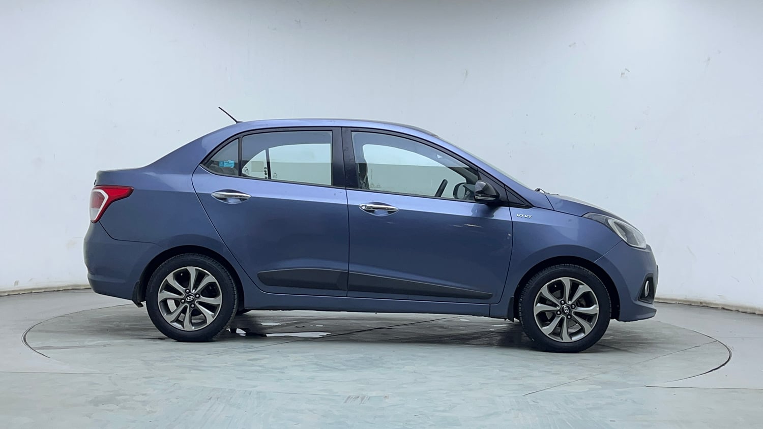 Used 2014 Hyundai Xcent SX 1.2 (O) Petrol Manual exterior RIGHT SIDE VIEW