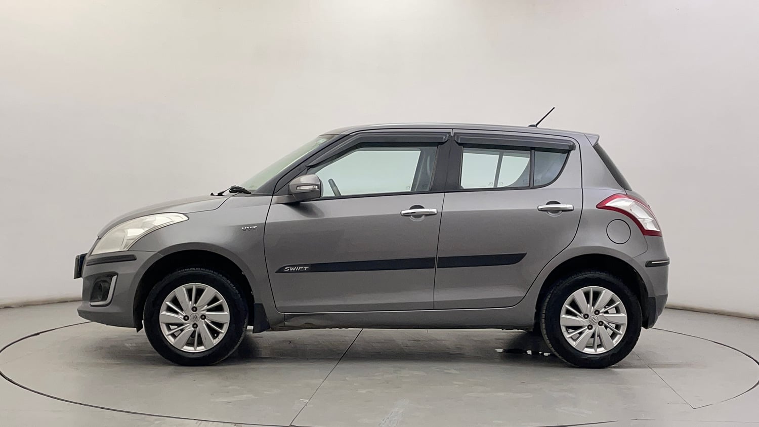 Used 2015 Maruti Suzuki Swift ZXi Petrol Manual exterior LEFT SIDE VIEW