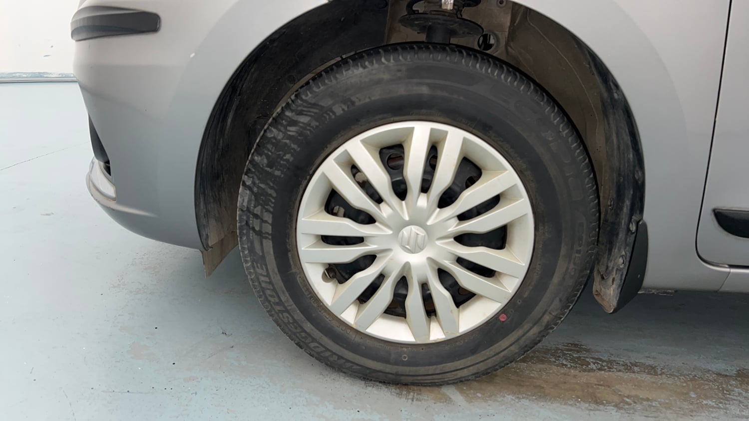 Used 2021 Maruti Suzuki Dzire VXi Petrol Manual tyres LEFT FRONT TYRE RIM VIEW