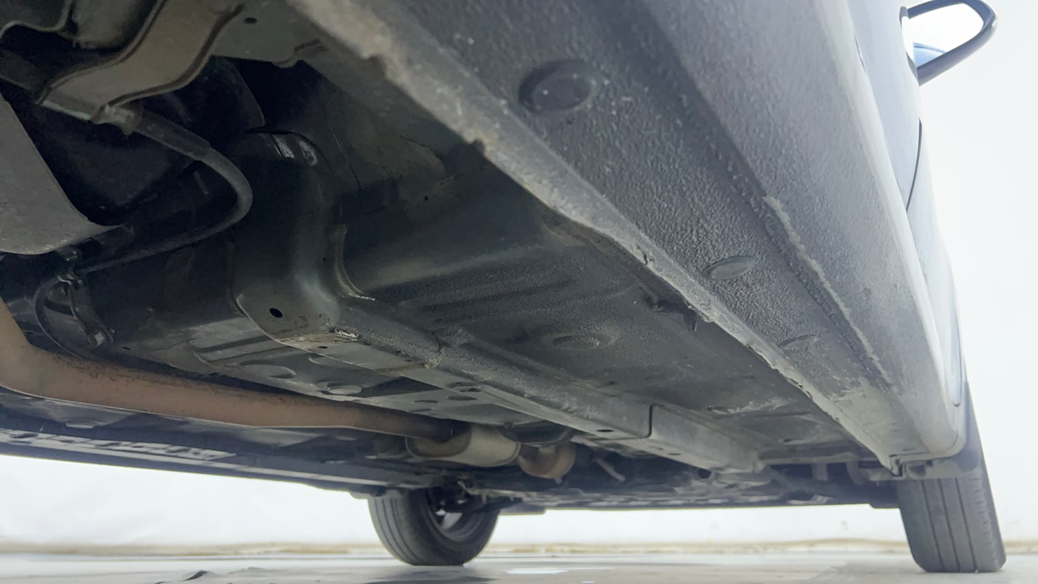 Used 2021 Hyundai Aura SX Plus 1.2 AMT Petrol Petrol Automatic extra REAR RIGHT UNDERBODY VIEW