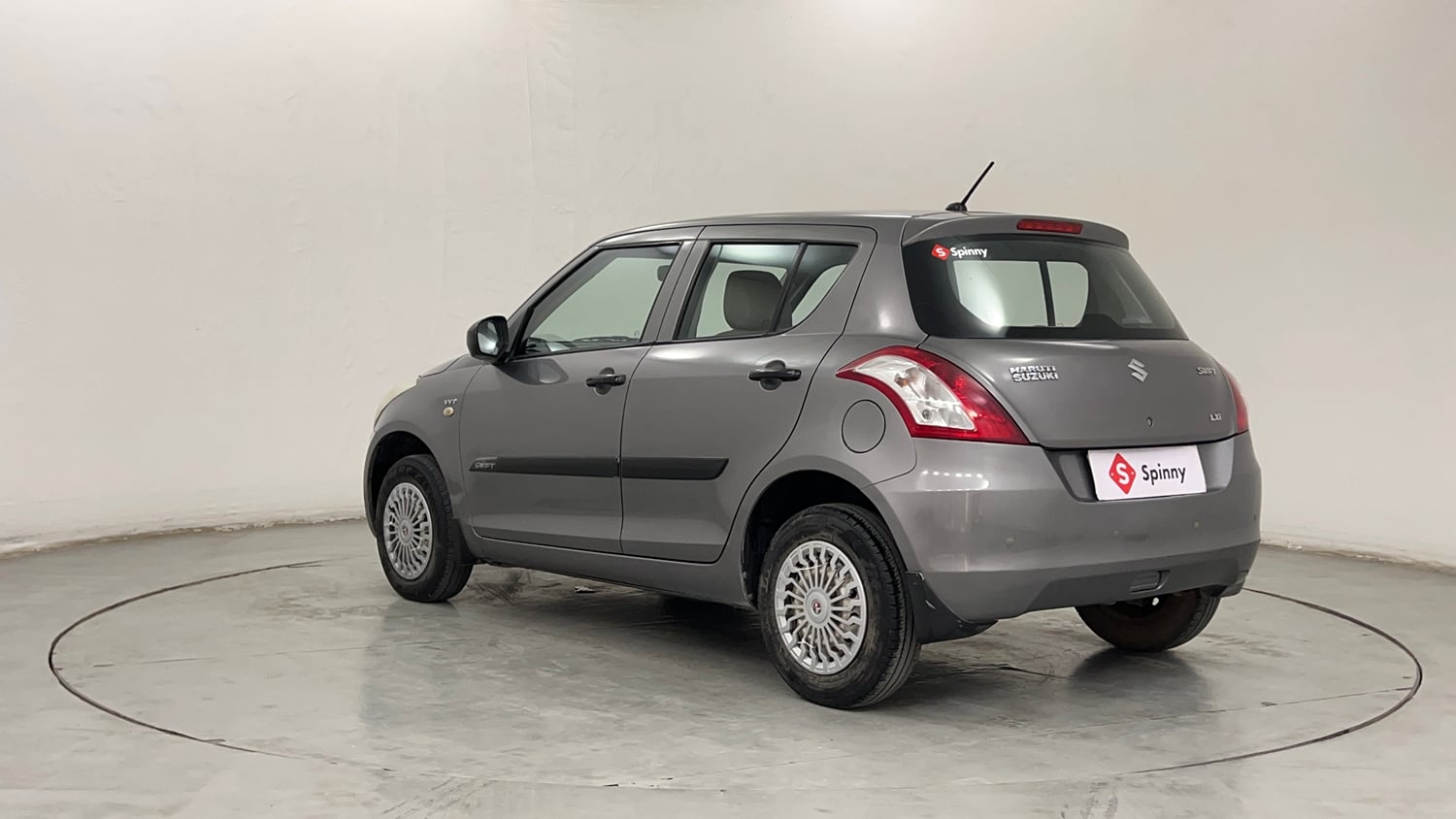 Used 2014 Maruti Suzuki Swift LXi Petrol Manual exterior LEFT REAR CORNER VIEW
