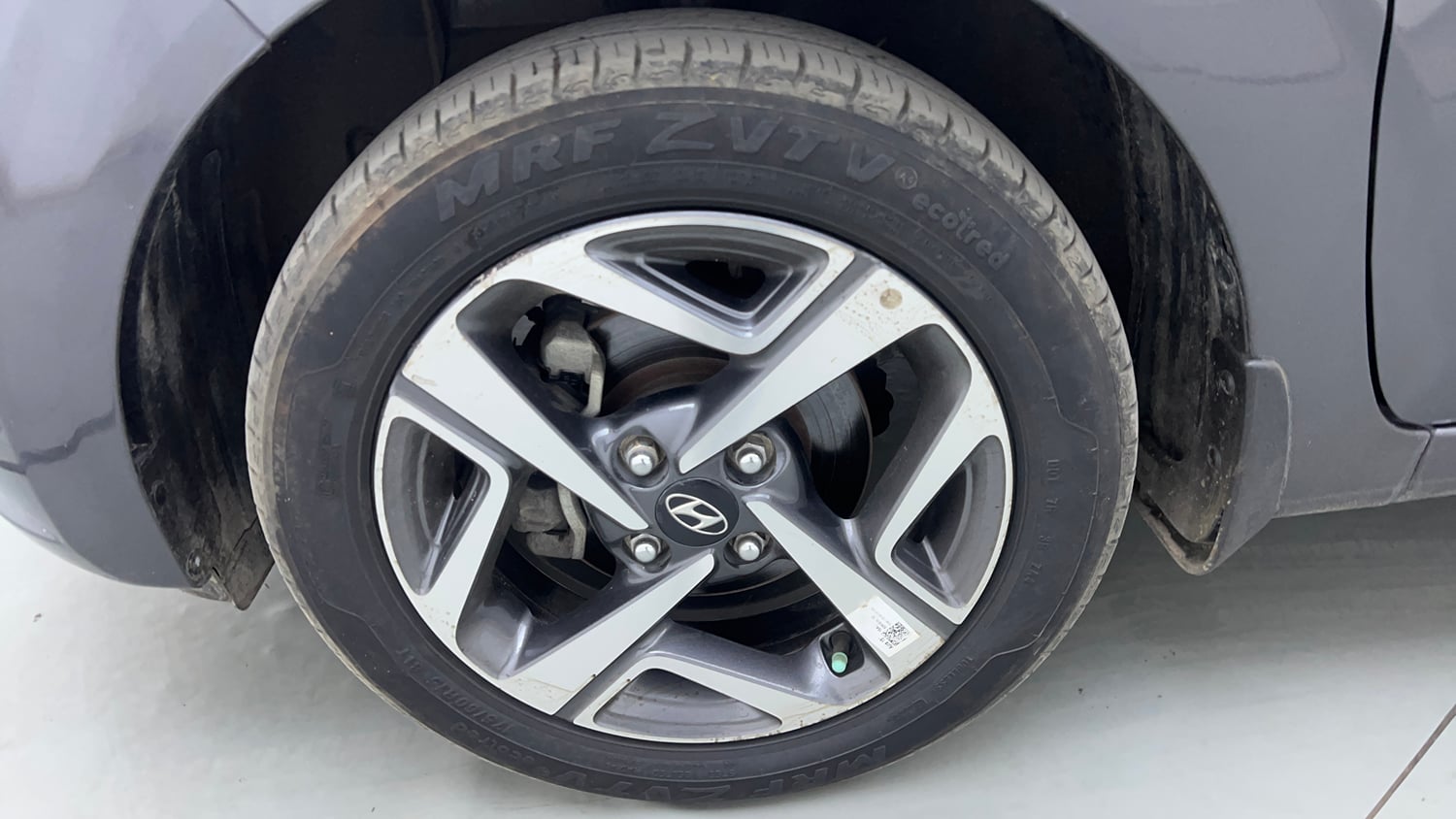 Used 2021 Hyundai Aura SX Plus 1.2 AMT Petrol Petrol Automatic tyres LEFT FRONT TYRE RIM VIEW