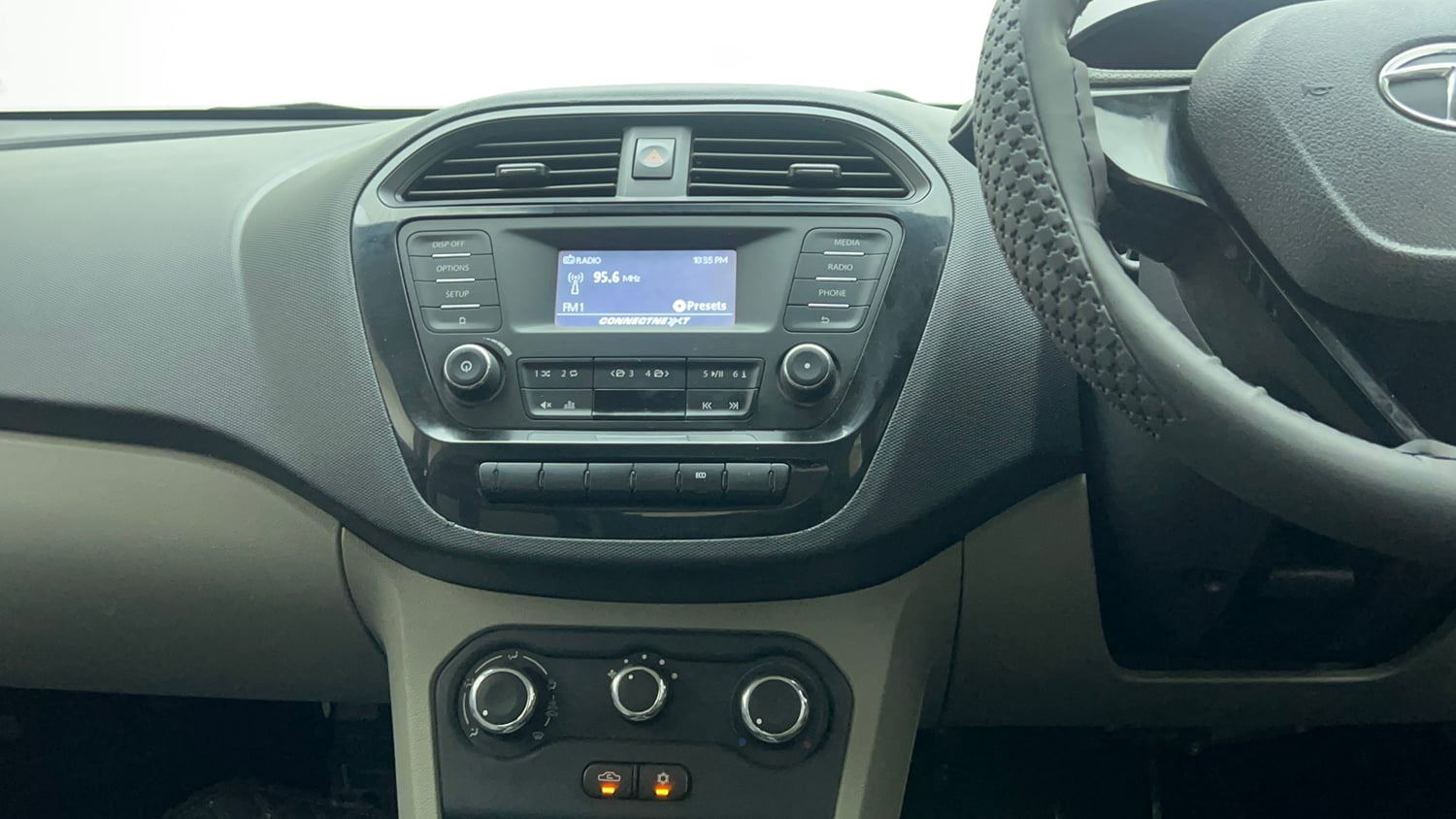 Used 2018 Tata Tiago Revotron XT Petrol Manual top_features Integrated (in-dash) music system