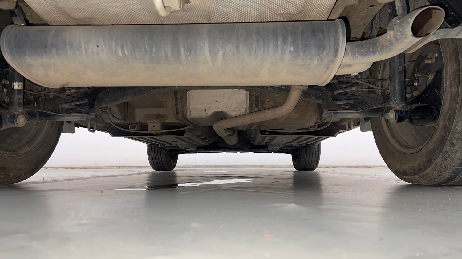 Used 2023 Maruti Suzuki Brezza VXi Petrol Manual extra REAR UNDERBODY VIEW (TAKEN FROM REAR)