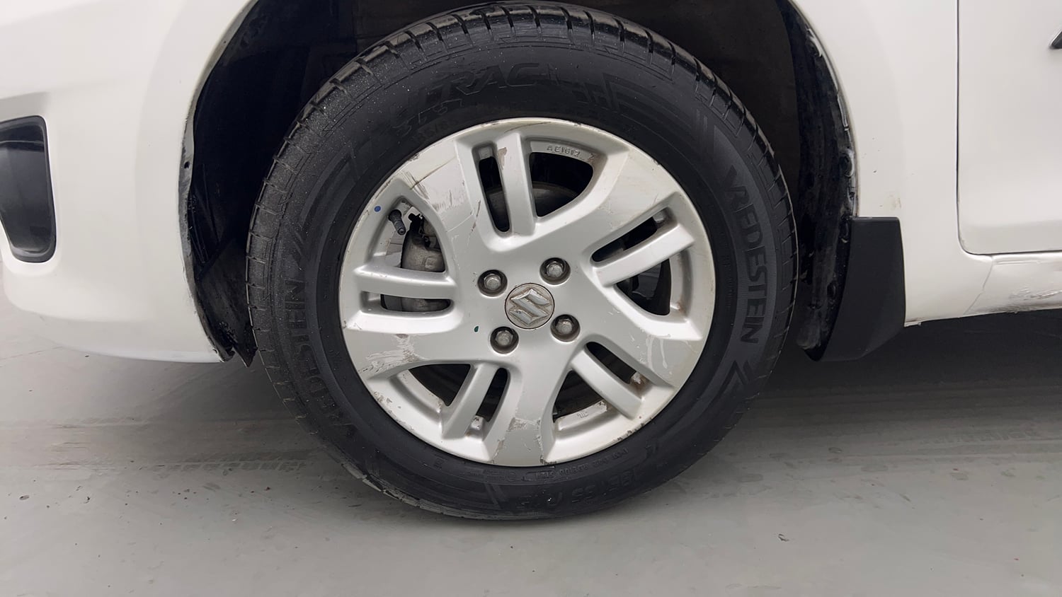 Used 2014 Maruti Suzuki Swift Dzire ZXI Petrol Manual tyres LEFT FRONT TYRE RIM VIEW
