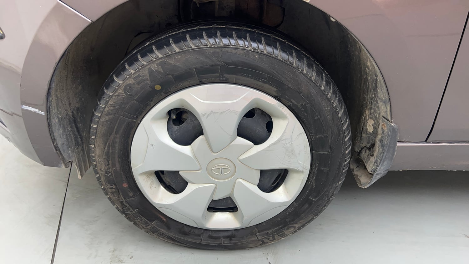 Used 2018 Tata Tiago Revotron XT Petrol Manual tyres LEFT FRONT TYRE RIM VIEW