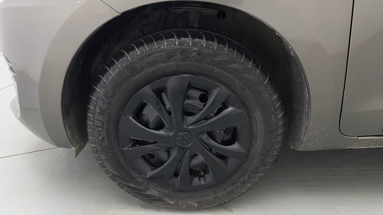 Used 2023 Maruti Suzuki Swift LXi Petrol Manual tyres LEFT FRONT TYRE RIM VIEW