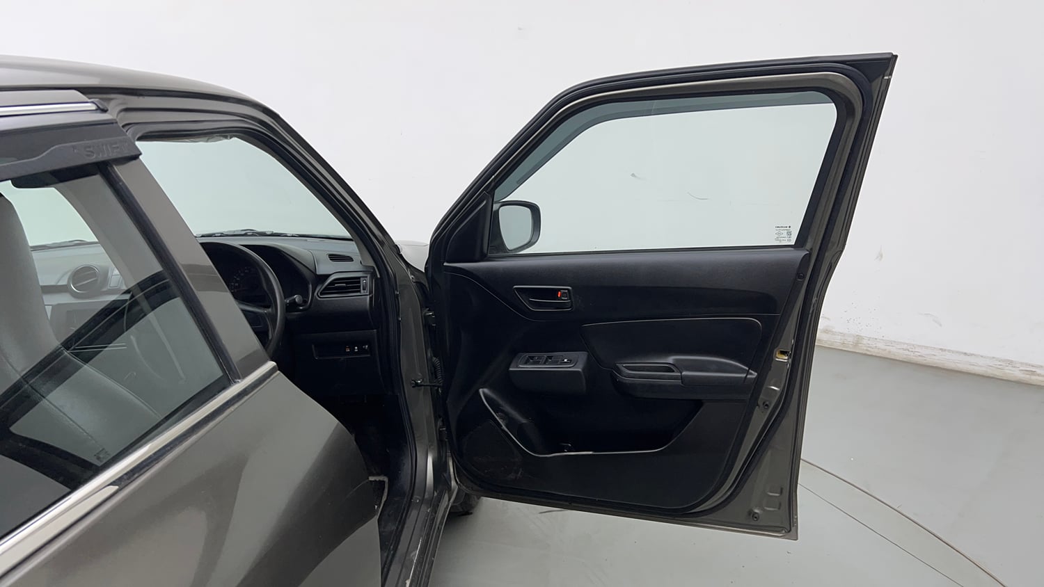 Used 2023 Maruti Suzuki Swift LXi Petrol Manual interior RIGHT FRONT DOOR OPEN VIEW