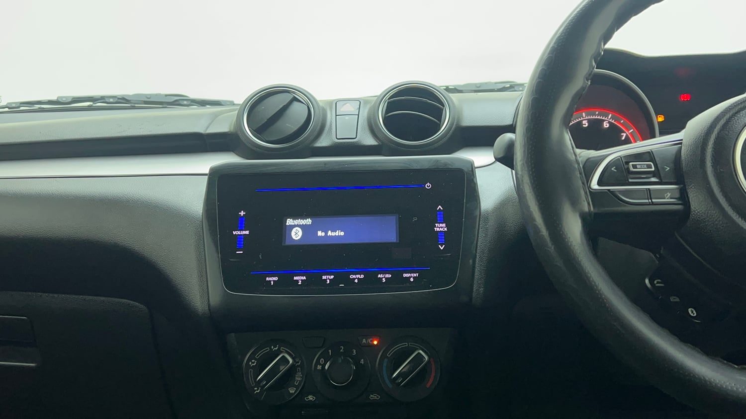 Used 2021 Maruti Suzuki Swift VXi Petrol Manual top_features Integrated (in-dash) music system