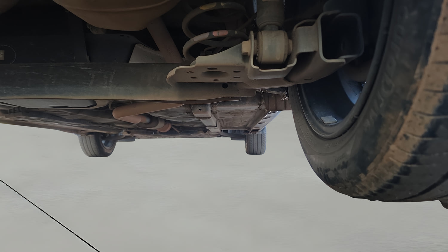 Used 2023 Hyundai Exter SX (O) Connect 1.2 AMT Petrol Automatic extra REAR RIGHT UNDERBODY VIEW