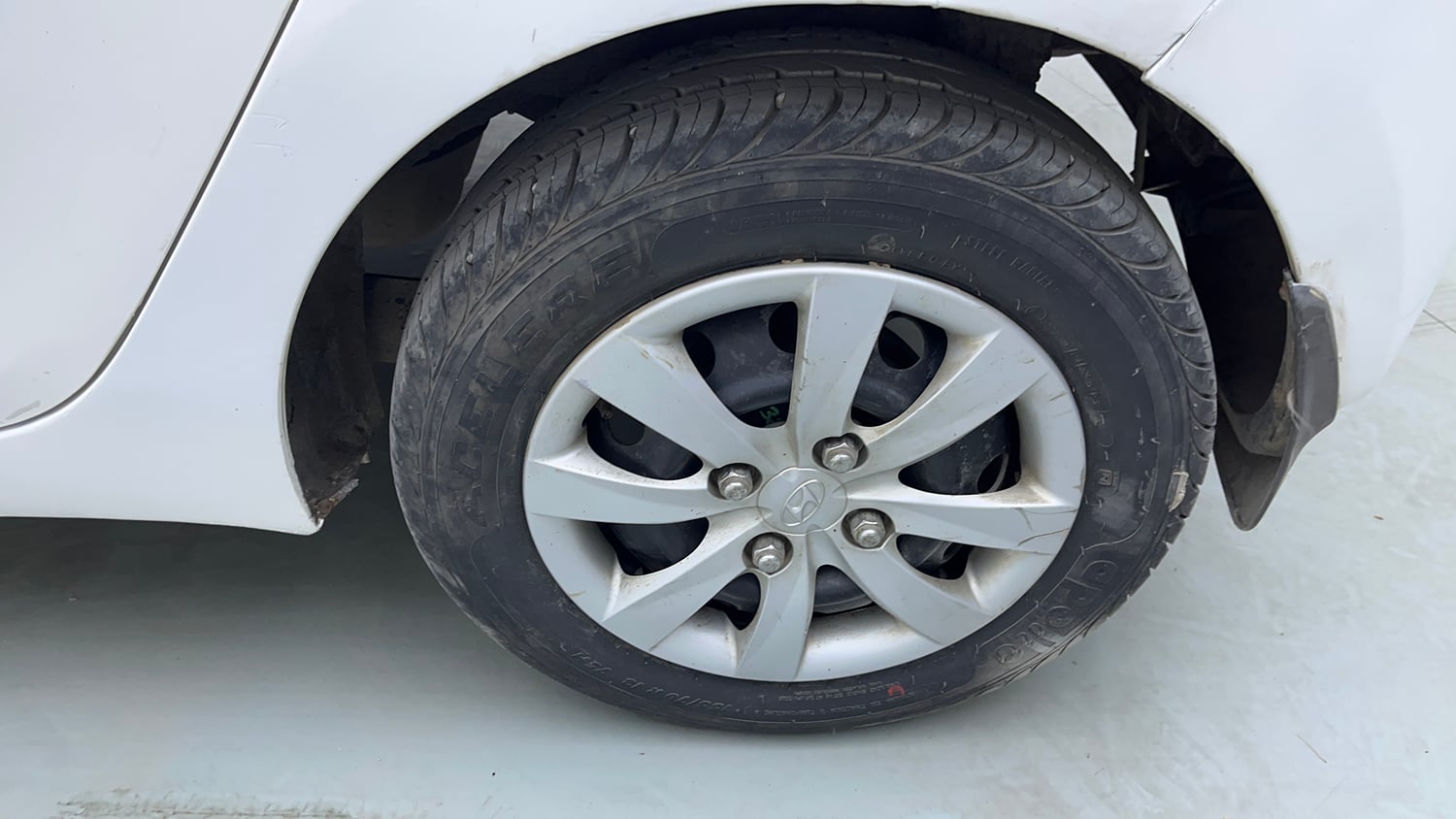 Used 2013 Hyundai Eon Sportz Petrol Manual tyres LEFT REAR TYRE RIM VIEW