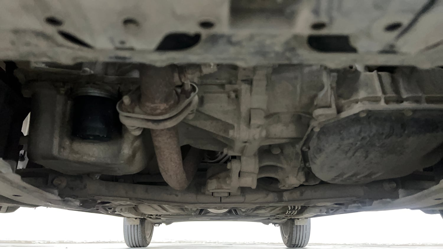Used 2021 Maruti Suzuki Baleno Zeta Automatic Petrol Automatic extra FRONT LEFT UNDERBODY VIEW