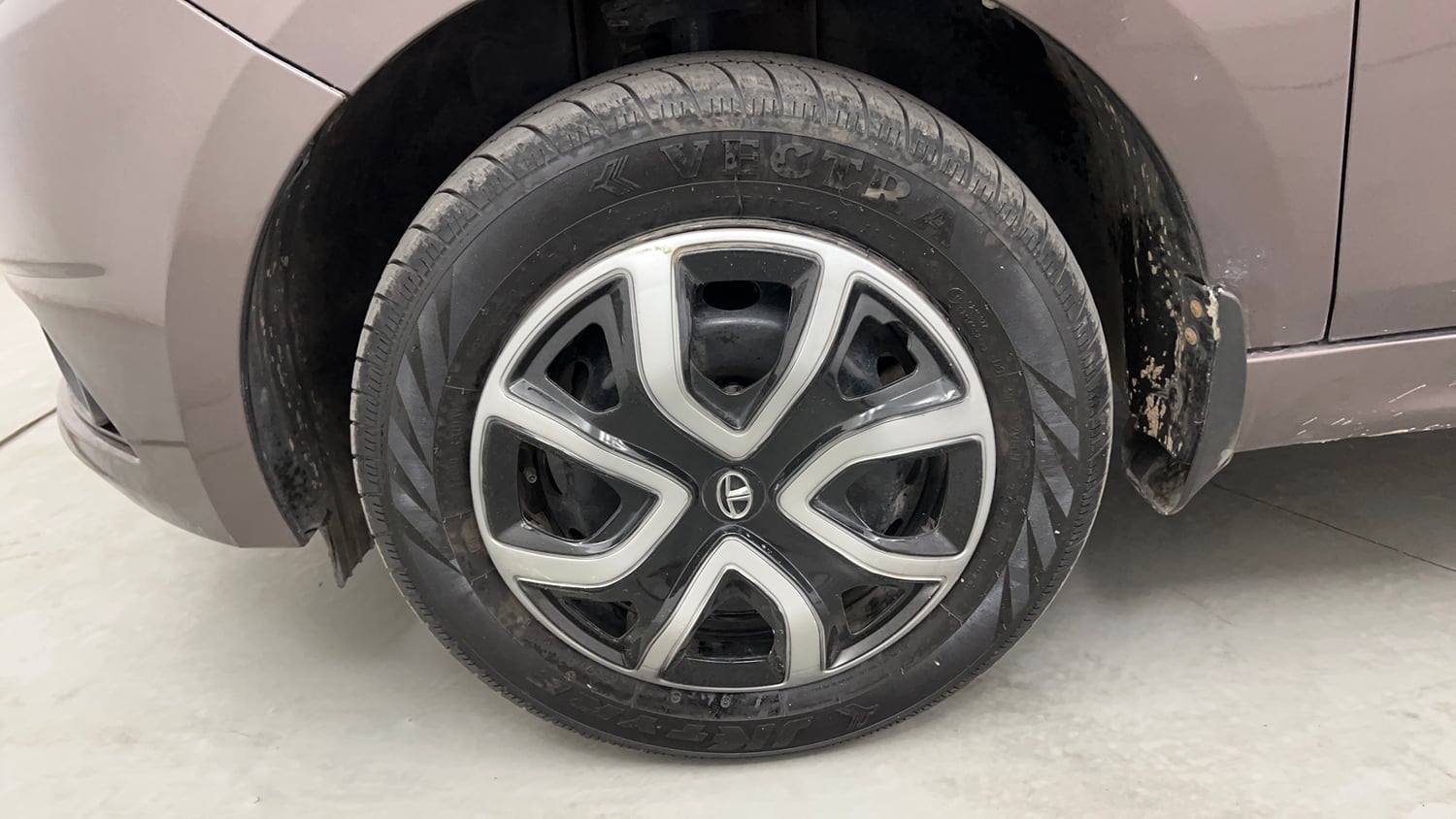 Used 2018 Tata Tiago Revotron XT Petrol Manual tyres LEFT FRONT TYRE RIM VIEW