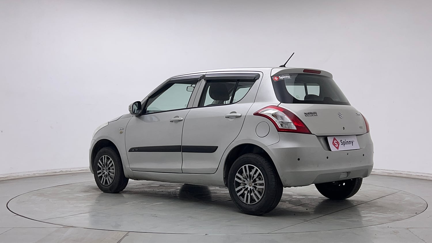 Used 2016 Maruti Suzuki Swift Lxi (O) Petrol Manual exterior LEFT REAR CORNER VIEW