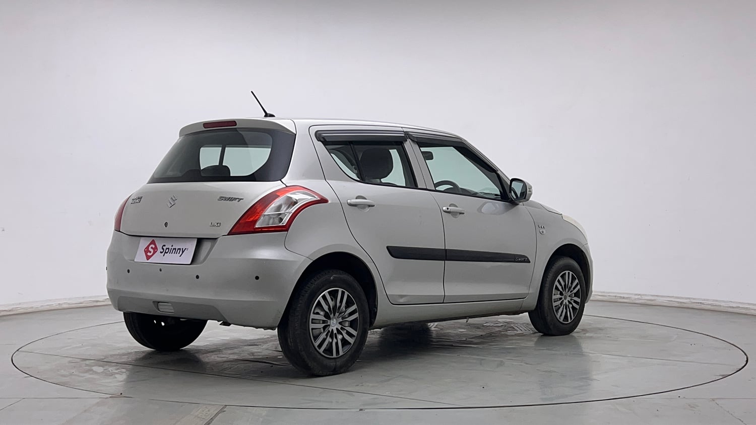 Used 2016 Maruti Suzuki Swift Lxi (O) Petrol Manual exterior RIGHT REAR CORNER VIEW