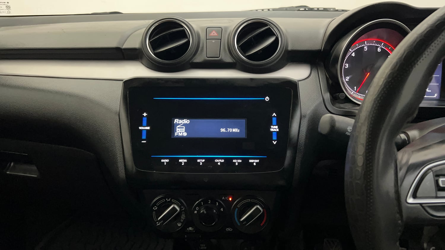 Used 2022 Maruti Suzuki Swift VXi Petrol Manual top_features Integrated (in-dash) music system