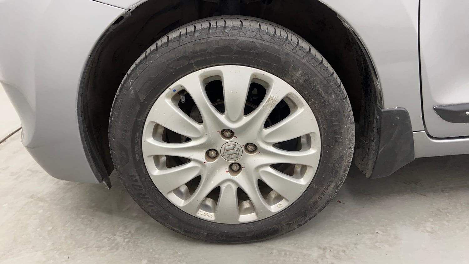 Used 2015 Maruti Suzuki Baleno Zeta 1.2 Petrol Manual tyres LEFT FRONT TYRE RIM VIEW