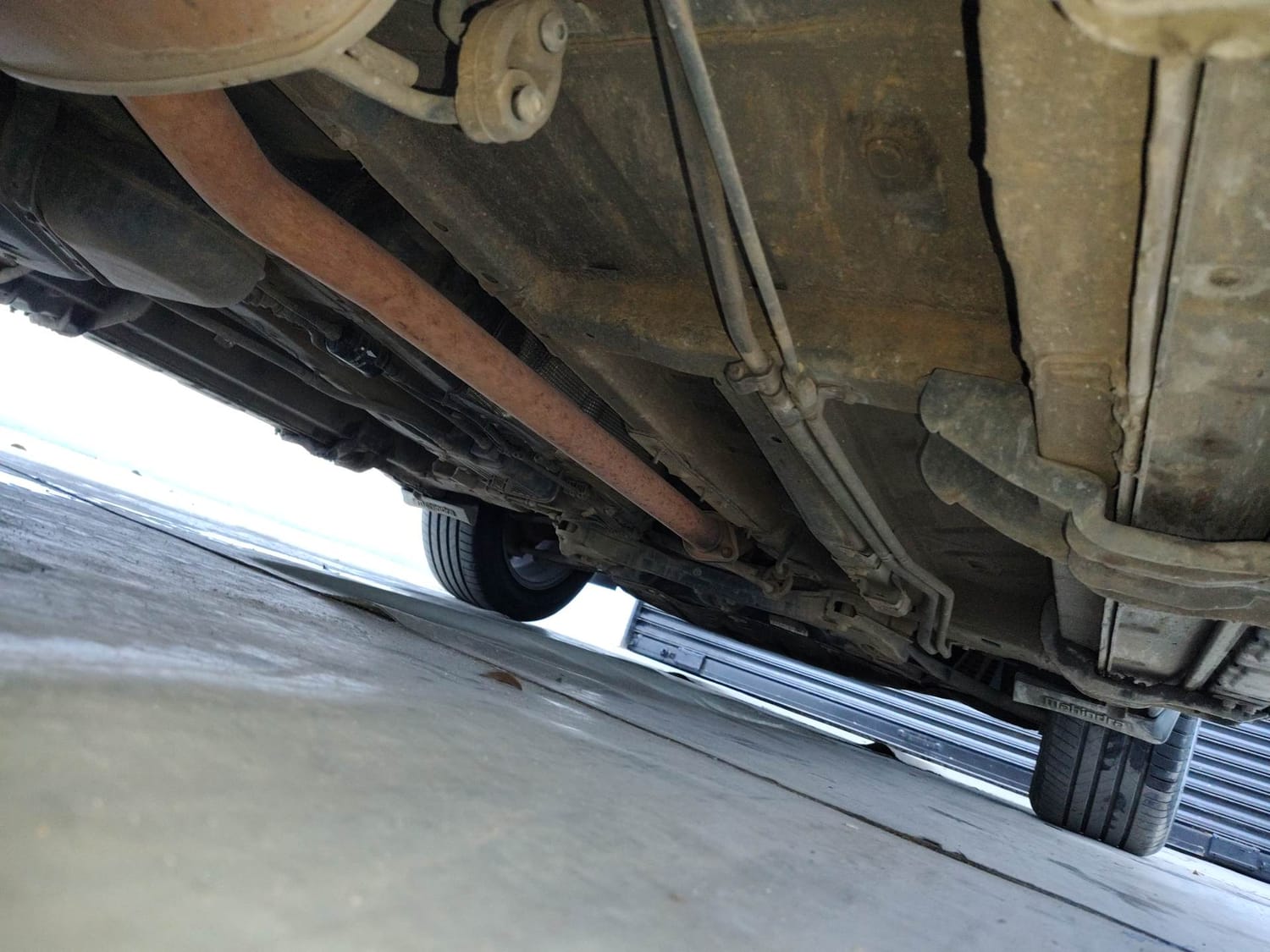 Used 2023 Mahindra XUV700 AX 7 Luxury Pack Petrol AT 7 STR Petrol Automatic extra REAR RIGHT UNDERBODY VIEW