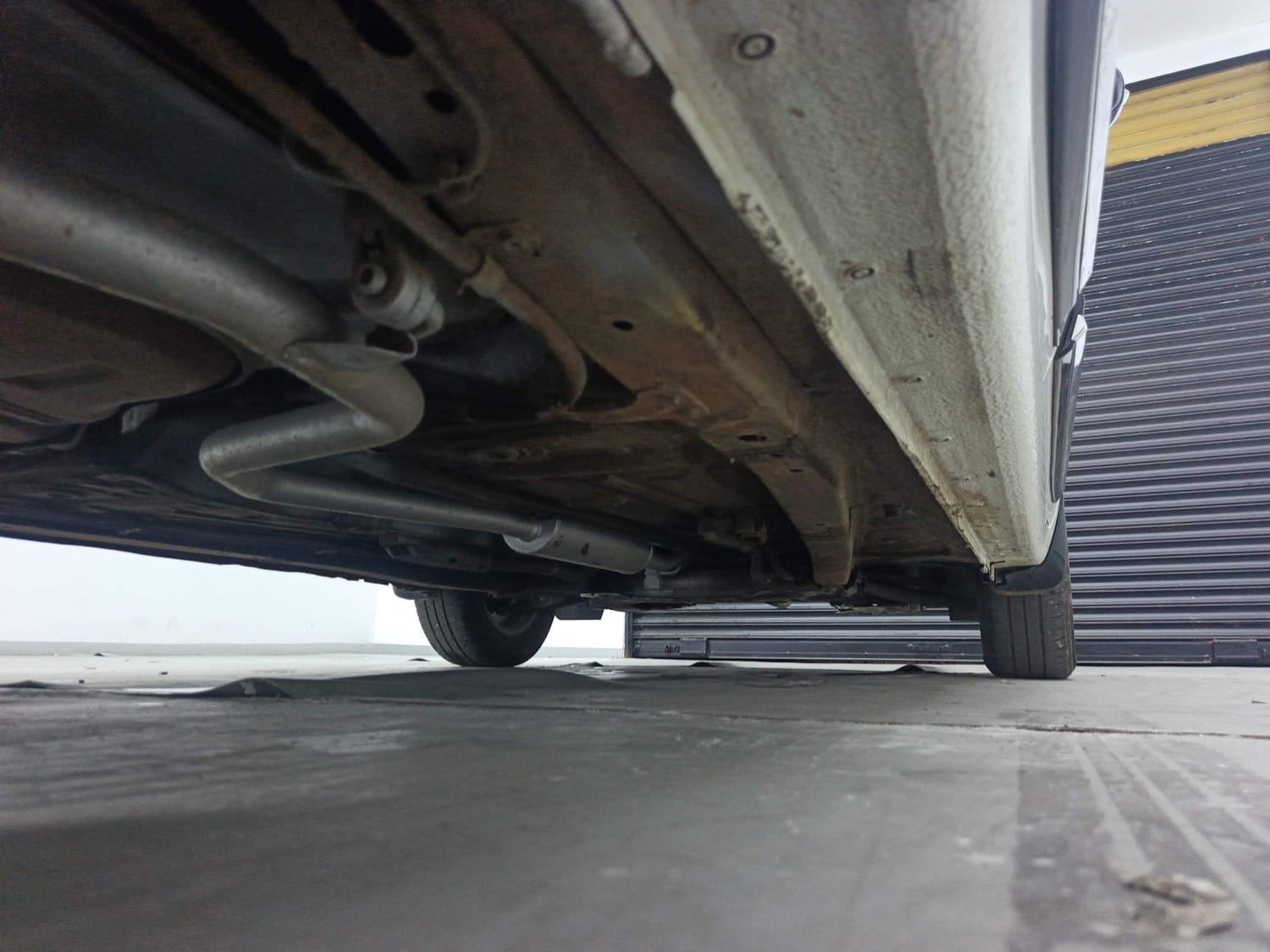 Used 2024 Maruti Suzuki Ertiga VXi AT Petrol Automatic extra REAR RIGHT UNDERBODY VIEW