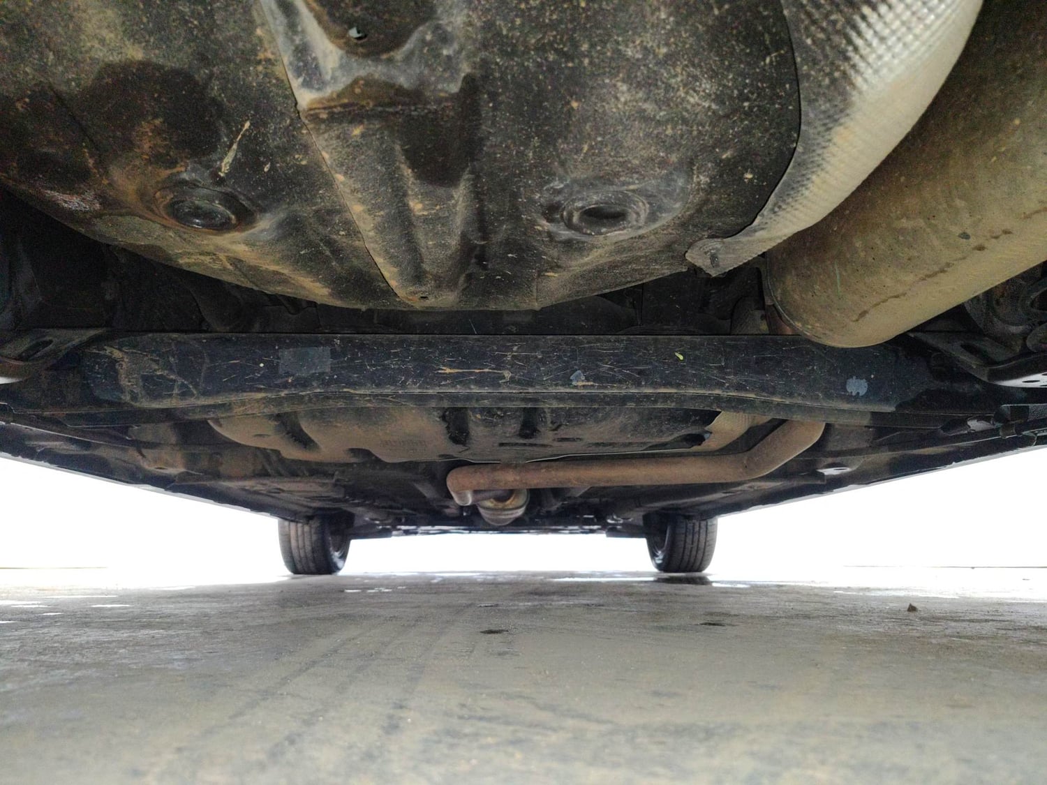 Used 2023 Hyundai New i20 Asta (O) 1.0 Turbo DCT Petrol Automatic extra REAR UNDERBODY VIEW (TAKEN FROM REAR)