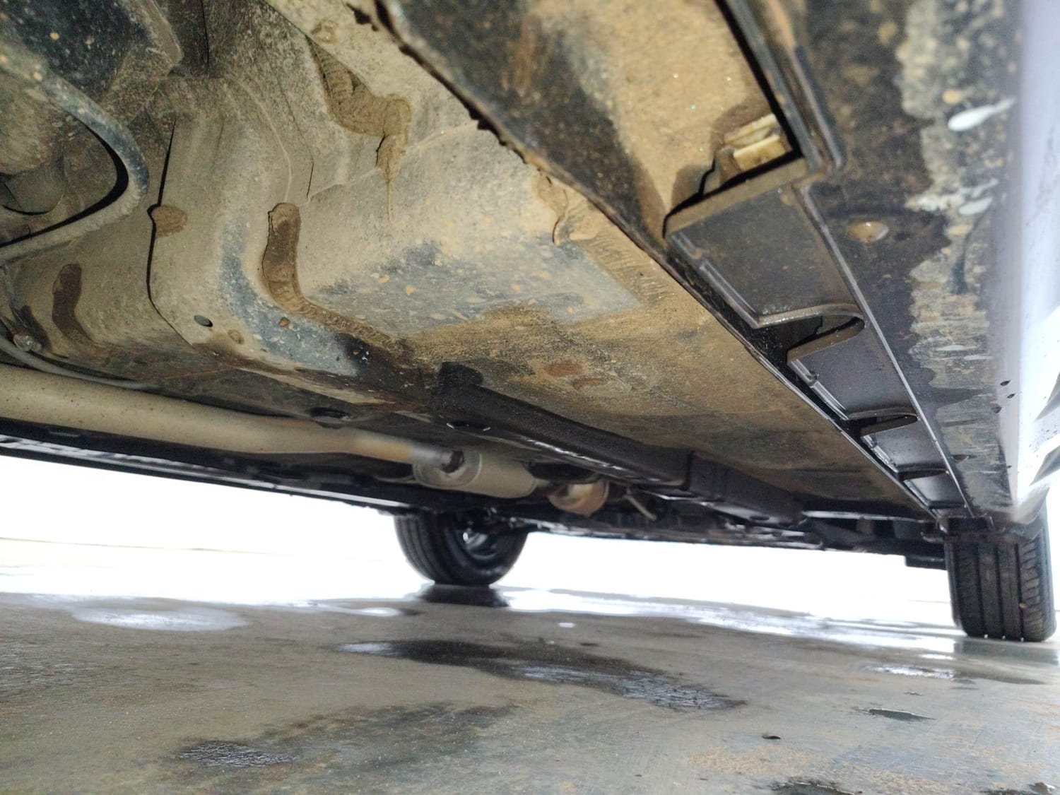 Used 2024 Hyundai Exter SX (O) Connect 1.2 AMT Knight Edition Petrol Automatic extra REAR RIGHT UNDERBODY VIEW