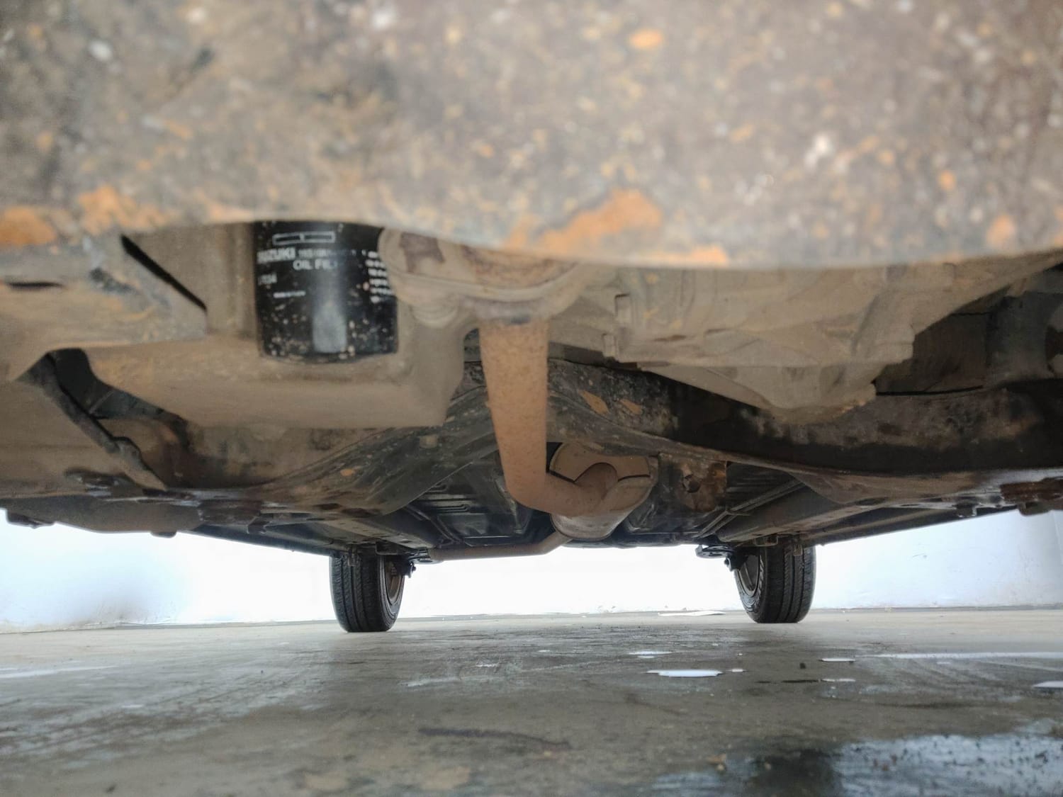 Used 2014 Maruti Suzuki Celerio VXi AMT Petrol Automatic extra FRONT LEFT UNDERBODY VIEW